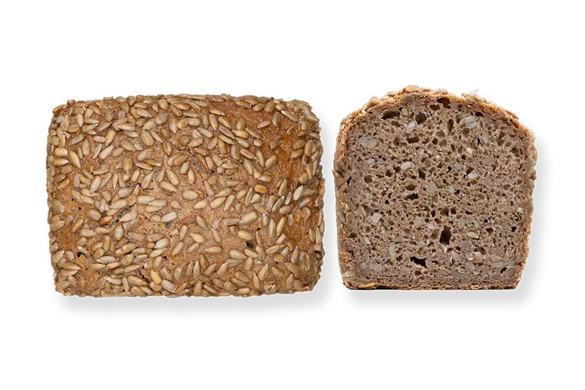 Sonnenblumenlaible aus Bioland-Vollkornmehl mit Sonnenblumenkernen als Kastenbrot mit Anschnitt – Bio Bäckerei Berger